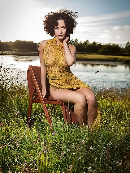 Curly brunette stunner gets completely naked outdoors,  by the ri