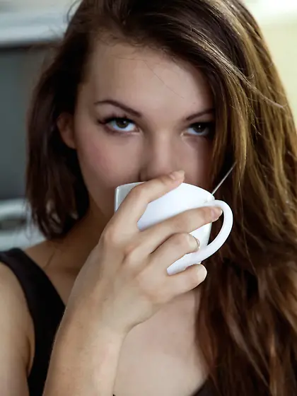 Iva Rogned seems to be enjoying her cup of Joe and your attentio