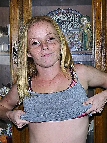 Pale blonde teen in a grey top masturbating