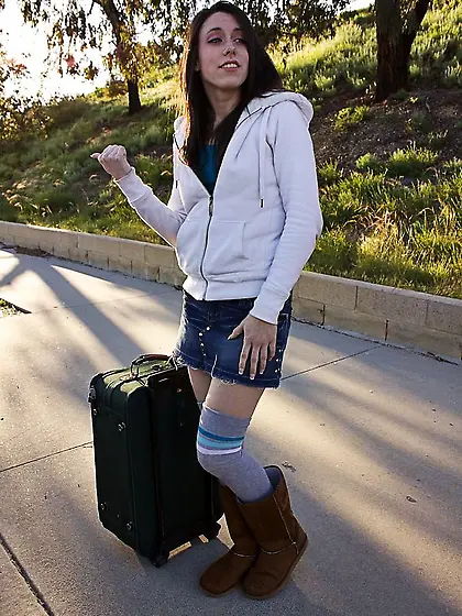 Teenage slut Janie Jones with long legs offers her bald pussy to