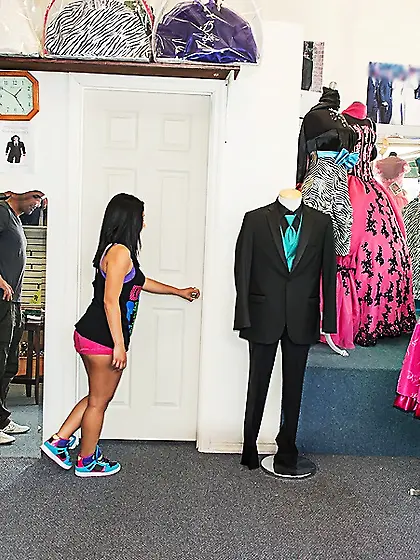 Adorable young little angel meets a photographer in a clothing s