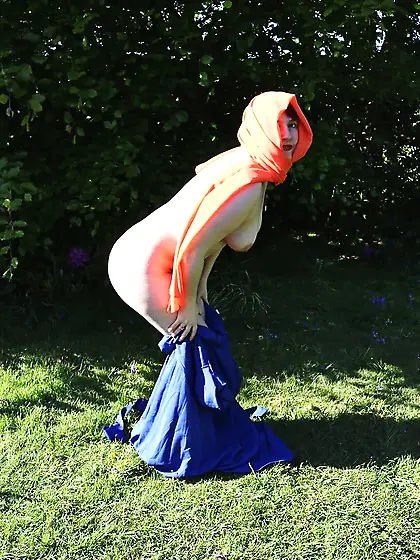 hijab and abaya flashing outdoors