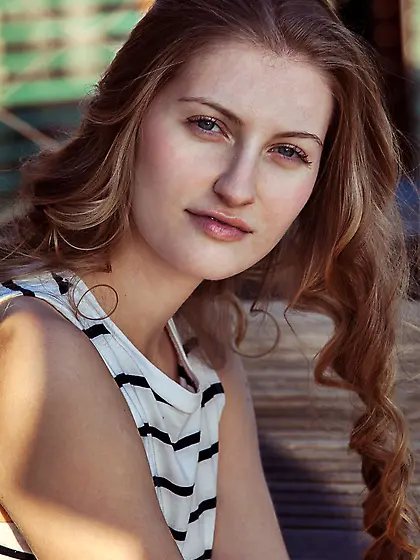 Striped get-up curly-haired hottie decides to undress in the kit