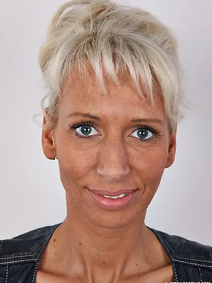 Busty blonde babe with silicon tits and tattoo