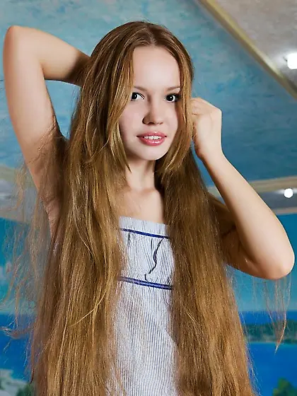 Big brown eyes beauty adores sand on her...