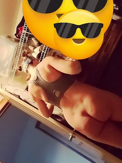 Spy pic--bare ass bimbo dressing