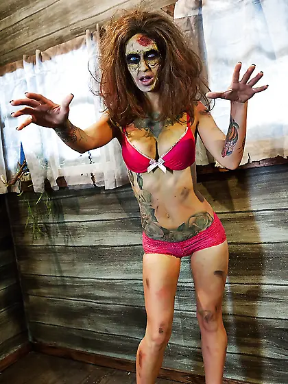 Female zombie with blue eyes and tattoos looks for a cock to sat