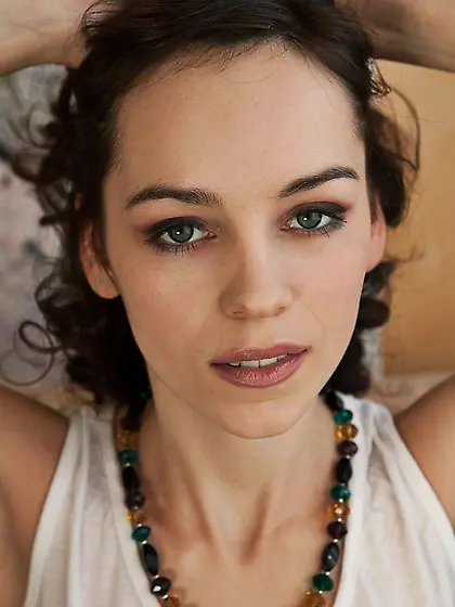 Brunette chick Leann A is lying closely to camera and masturbati