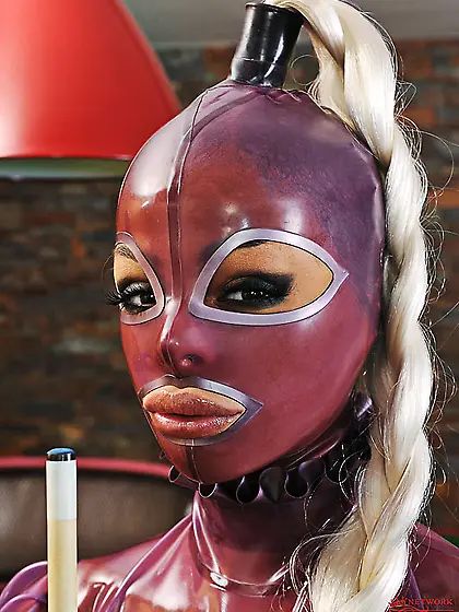 Lesbian rubber-clad dolls Black Angelica and Eve Angel have fun