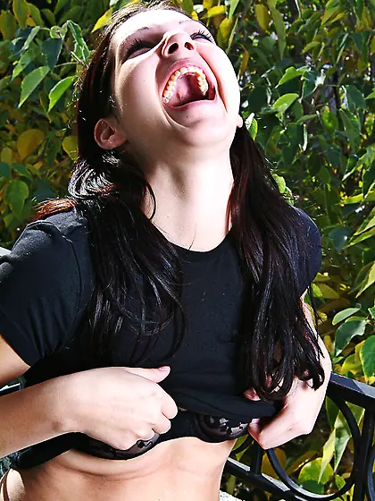 Tender brunette Kathleen Kruz flashes her tits and exposes her b