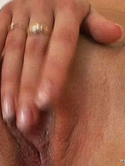 Katrin Wolf spreads her sexy legs for the camera and pokes her c