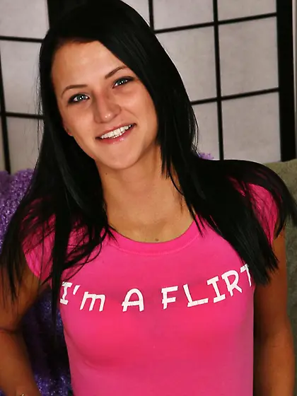 Tanned small titted brunette Brandy Bates shows her long legs an