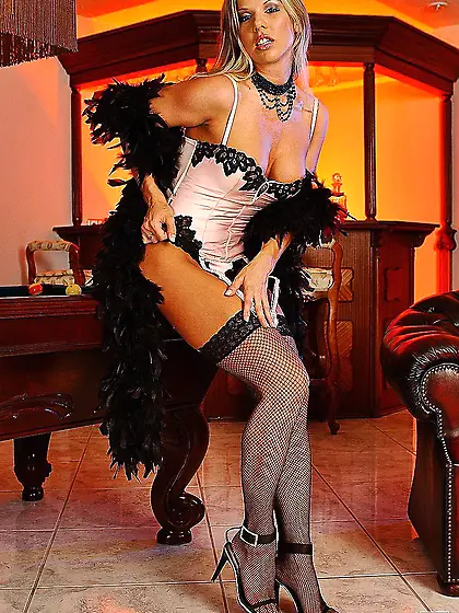 Lustful blonde Ginger Jones in white corset and stockings uses a