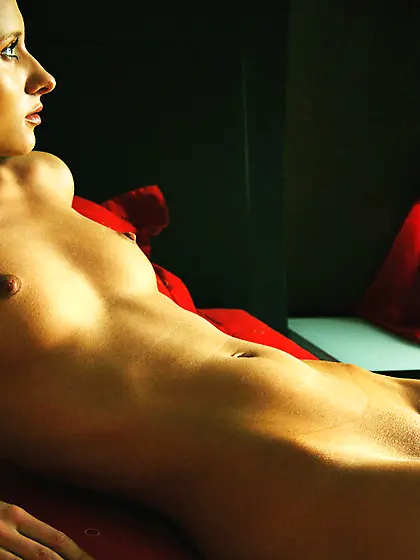 Lena L strips all of her lingerie on the bed and teases us with