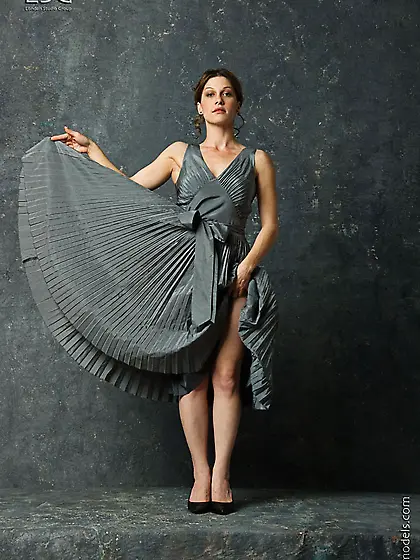 Attractive girl Kymberly is in long dress