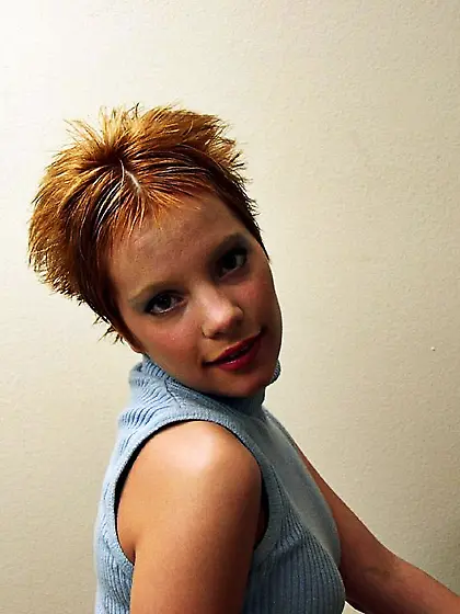 Beautiful short hairred babe Emily DaVinci strips on the sofa an