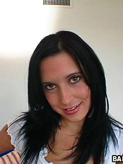 Pretty brunette teen Dasani Lysiane strips to show her tanned bo