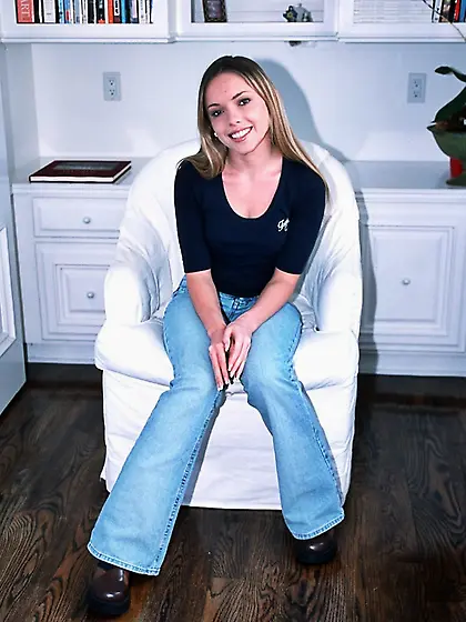 Solo gallery of the smiling girl with small flower tattoo on the