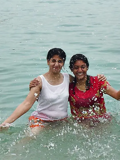 Indian Women bathing at sea ganga