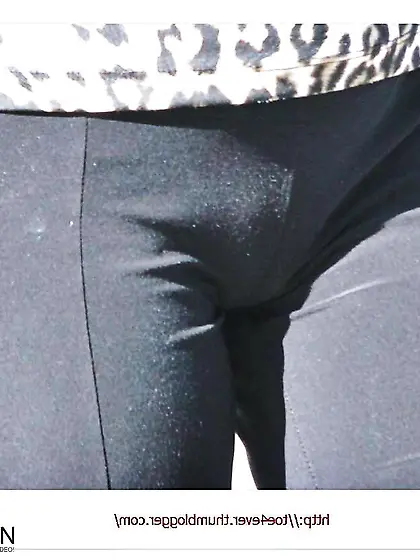 Walking with her cameltoe draping out