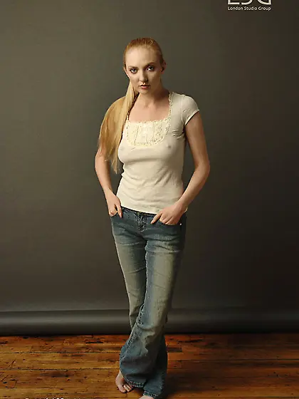 Charming blonde Tiana Hunter poses in revealing light blue panti