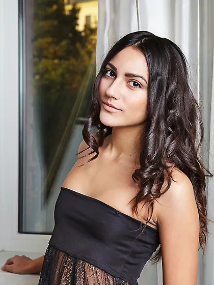 Slender brunette pulls black