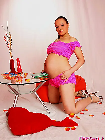 Beautiful preggo playing red